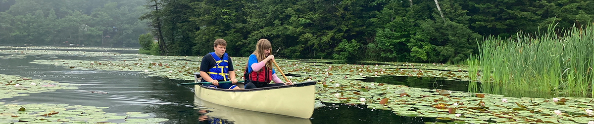 Two students enjoying a canoe ride during an Explorers Program activity
