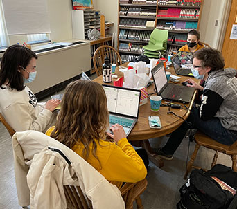 Student talking with teacher